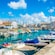A European village next to a small marina filled with pleasure boats